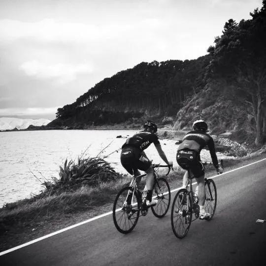 Cyclists gathered at a roadside meetup point